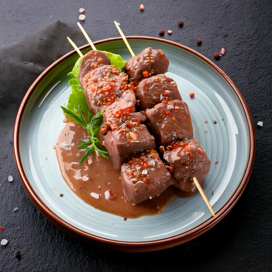 Brochette de veau mariné girolles 180g.